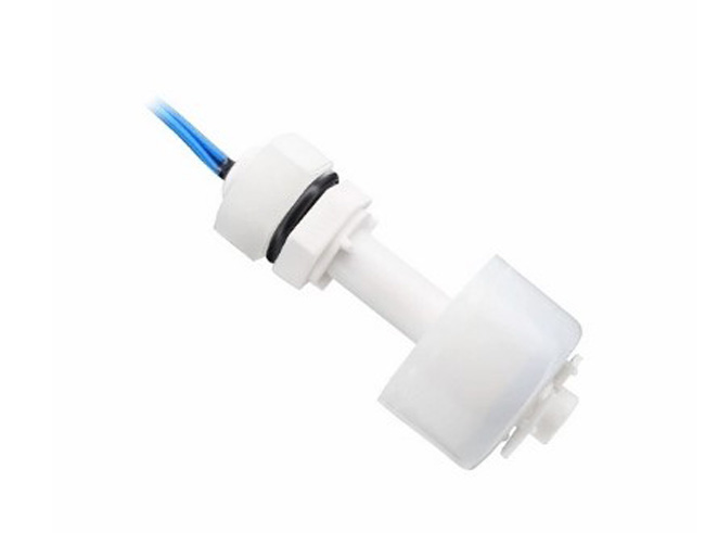 A white PVDF float switch demonstrating proper material selection for corrosive chemicals and acids.